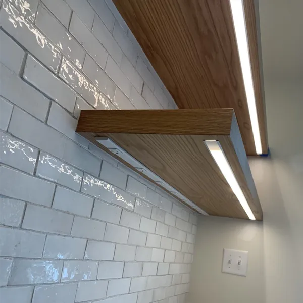 Kitchen floating shelves showing led lighting installation.
